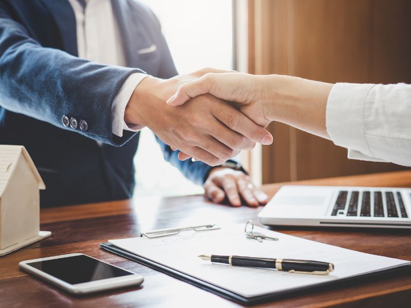 client handshake representing a completion of a financial agreement