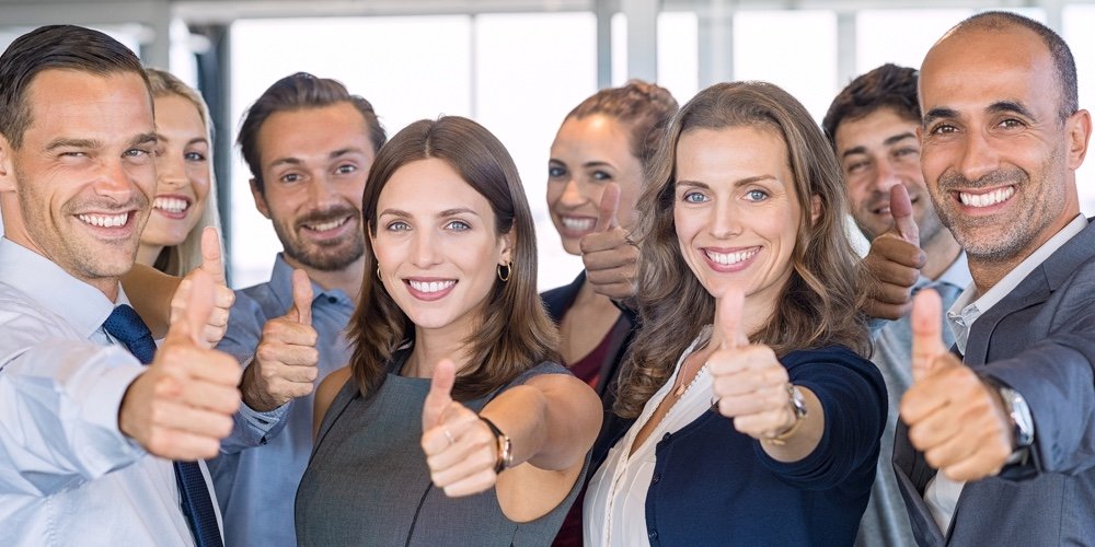 group of happy employees showing acceptance with thumbs up at Capital Lending Solutions LLC