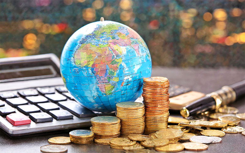 Globe, Calculator and Money all describing international finance